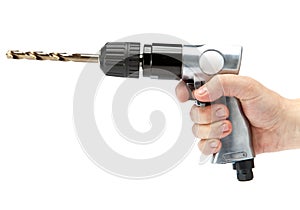 The hand holds reversible air drill on a white background