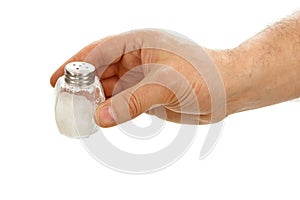 Hand holds salt cellar