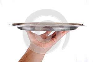 Hand holds a serving tray