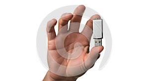 Hand Holding a USB Flash Drive Against a White Background, Close Up