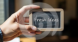 A hand holds a small rectangular