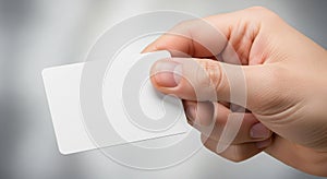 A hand holds a small, rectangular