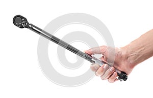 The hand holds a torque wrench. Close up. Isolated on a white background