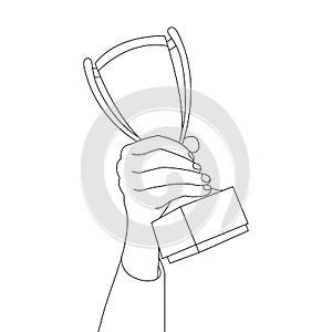 Hand holds trophy cup drawn by lines. The concept of a symbol of victory, champion, medalist, award, achievement