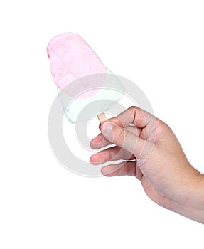 Hand holds vanila ice creame with strawberry.