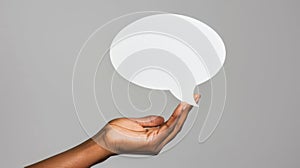 The hand with speech balloon. AI generated