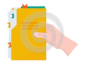 Hand holds a yellow folder with documents.