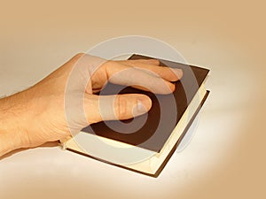 Hand on Holy Bible photo