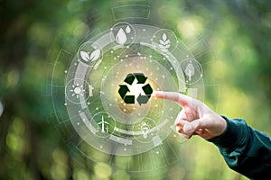 Hand of human touching the recycling symbol with environment icon, Save world, sustainable environment concept. Technology with