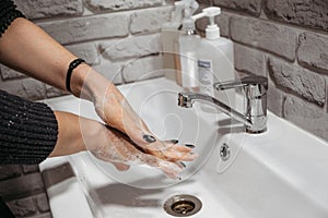 Hand hygiene. How to Wash Your Hands with soap and water. Women washing hands with antibacterial soap at home bathroom. Prevent
