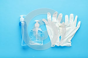 Hand hygiene, rubber gloves, different bottles of hand sanitizers, antiseptic gel. Virus protection, antibacterial gel, soap.