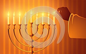 Hand igniting candles on the menorah photo