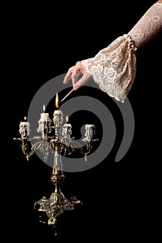 Hand igniting candles