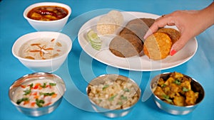 Hand of an Indian woman serving delicious Upwas food prepared for Navratri