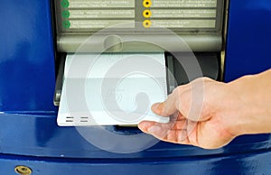 Hand inserting account bankbook