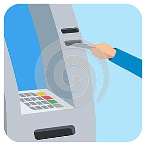 Hand inserting credit card into the atm slot