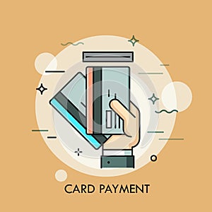 Hand inserting credit or debit card into slot. Payment method, money withdrawal, ATM service, transaction concept.