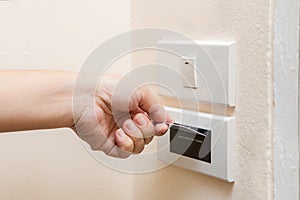 A hand inserting keycard in the electronic lock