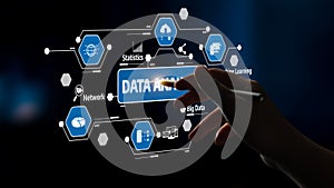 Hand Interacting with Data Analytics Interface on a Digital Screen Highlighting Big Data, Statistics, Network, and