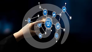 Hand Interacting with Digital Network Interface Featuring Various Icons Representing Technology and Connectivity