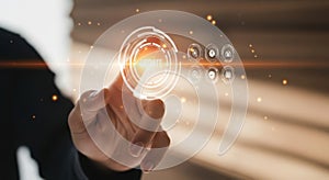 Hand interacting with futuristic glowing interface displaying digital data and analytics for business growth