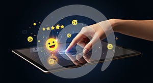 A hand interacts with a digital tablet, touching a glowing interface element.