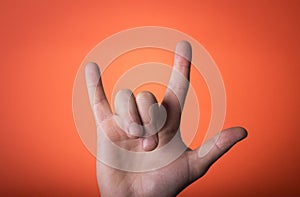 hand isolated on orange red background