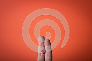 Hand isolated on orange red background