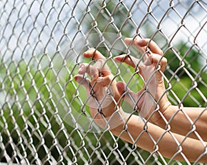 Hand in jail.