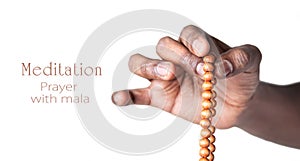 Hand with japa mala beads