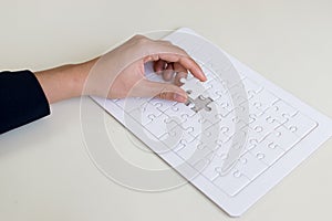 hand and jigsaw puzzle