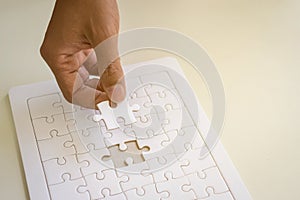 hand and jigsaw puzzle