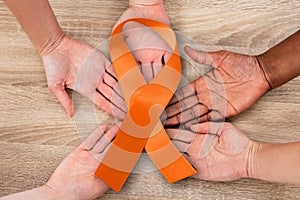Hand Joined In Circle Holding Uterine Cancer Symbol