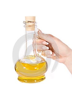 Hand and jug of oil