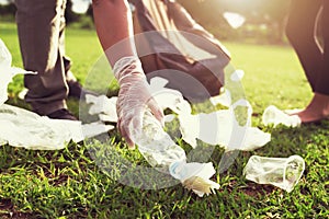 Hand keeping bottle garbage in to bag recycle