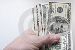 A hand keeps dollars