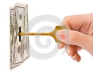 Hand with key and money