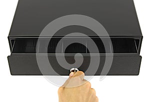 Hand with key open black cash drawer, top view white background, concept of finance audit  or commerce inspection
