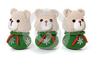 Hand knitted toy - new year bear on white background. Three angles. Full depth of field.