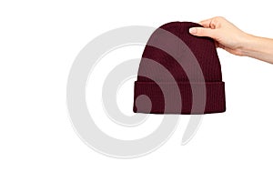 Hand with knitted wool hat, head accessory clothing