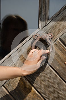 Hand knock retro rusty door handle ringer knocker photo