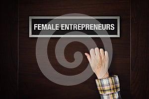 Hand is knocking on Female Entrepreneurs door