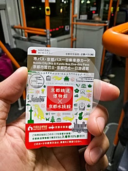 Hand with Kyoto bus one day pass