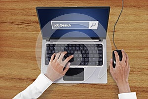 Hand with laptop and job search text