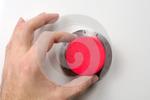 Hand launches the red kitchen timer