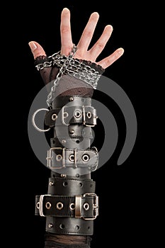 Hand in Leather Cuffs on Black