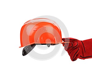 Hand in leather gloves holds hard hat.