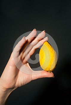 Hand with lemon