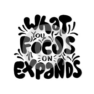 Hand Lettered What You Focus On Expands On White Background