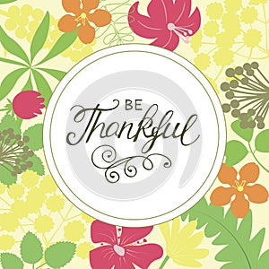 Hand lettering Be thankful on floral background.